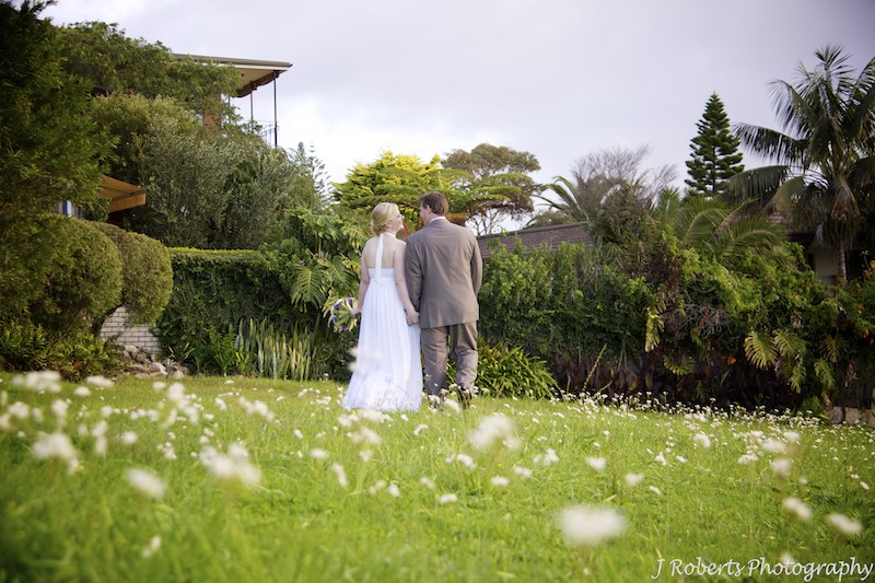 Bride and groom walking in park - wedding photography sydney